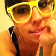 A cute girl video-records herself sitting on the toilet after taking a stinky shit. She calls for her friend to come in. After a brief appearance, her friend quickly reacts to the odor and runs out of the bathroom.